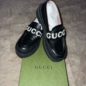 Gucci Black Leather Loafers with Bold Logo